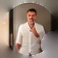 Matt Ralph, a student: a man in an open white shirt standing in a doorway