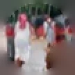 Tony Singleton, a student: a small group of people in white and red clothes, photographed outdoors