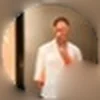 Matt Ralph: a man in an open white shirt standing in a doorway