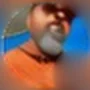 Rob Peterson: a bearded man with sunglasses pushed up, in an orange top